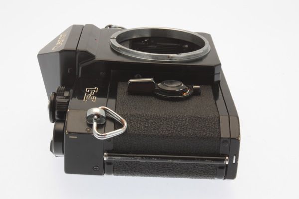 Appears that aperture preview lever to left side of lens mount housing 